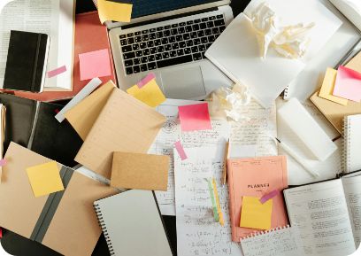 Organized desk with notes and laptop